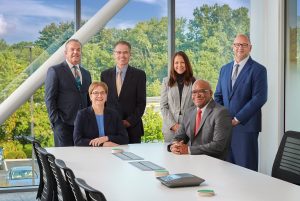 Group of executives around a table.