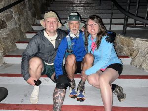 Three people smiling