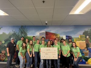 Group of people posing for photo